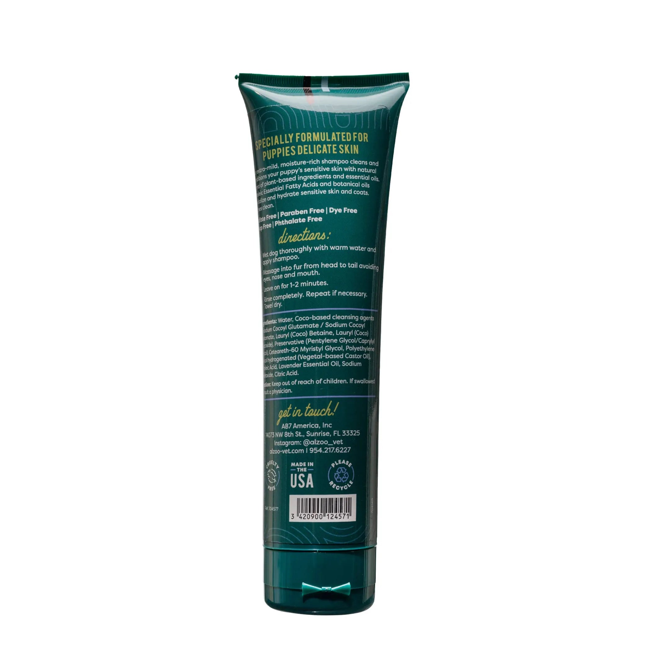 Back view of a green pet grooming product tube with text on a white background