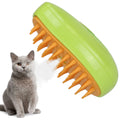 Green and orange pet grooming brush next to a gray cat on a white background