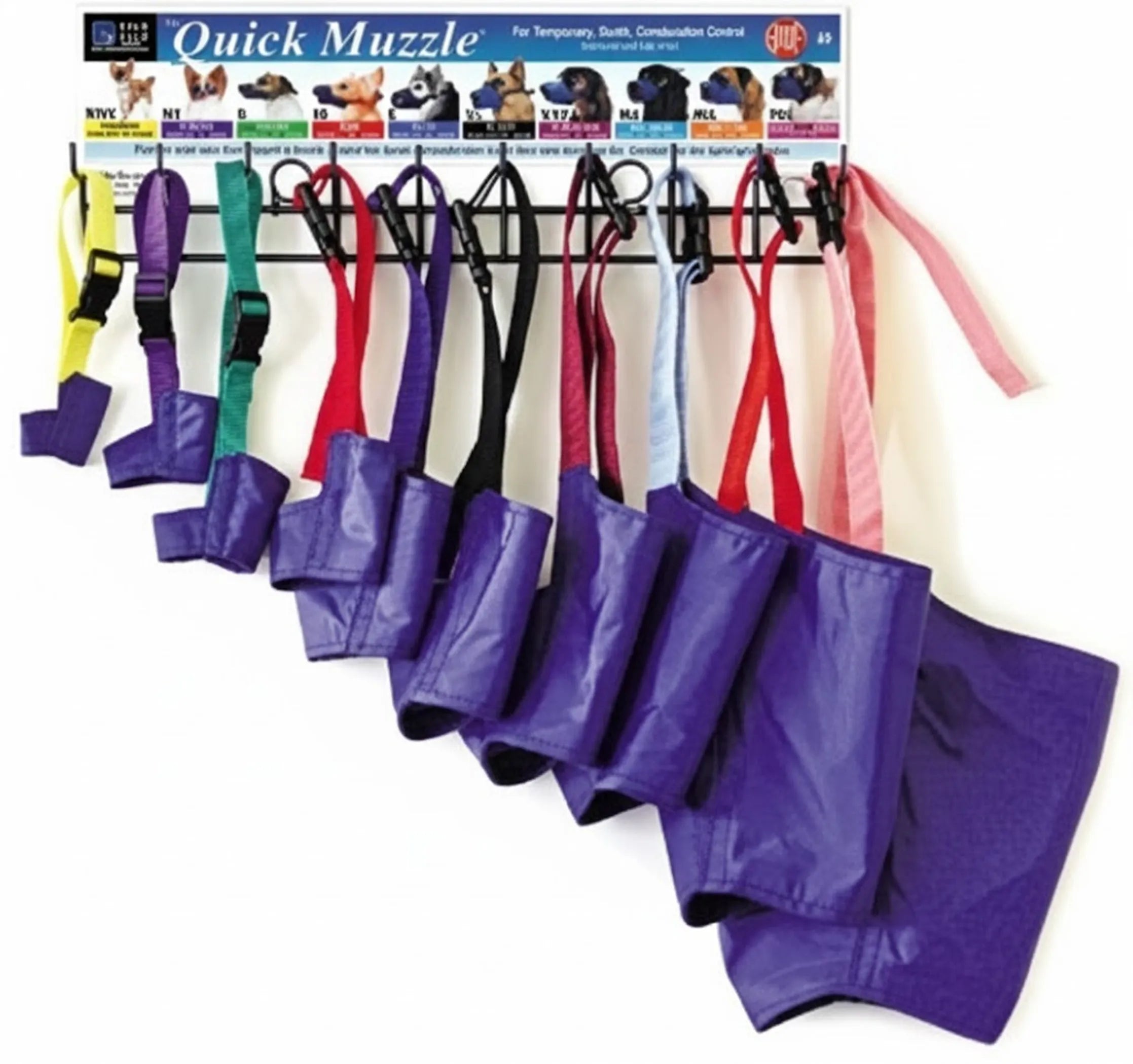 Set of dog muzzles in various colors with a display card in the background.